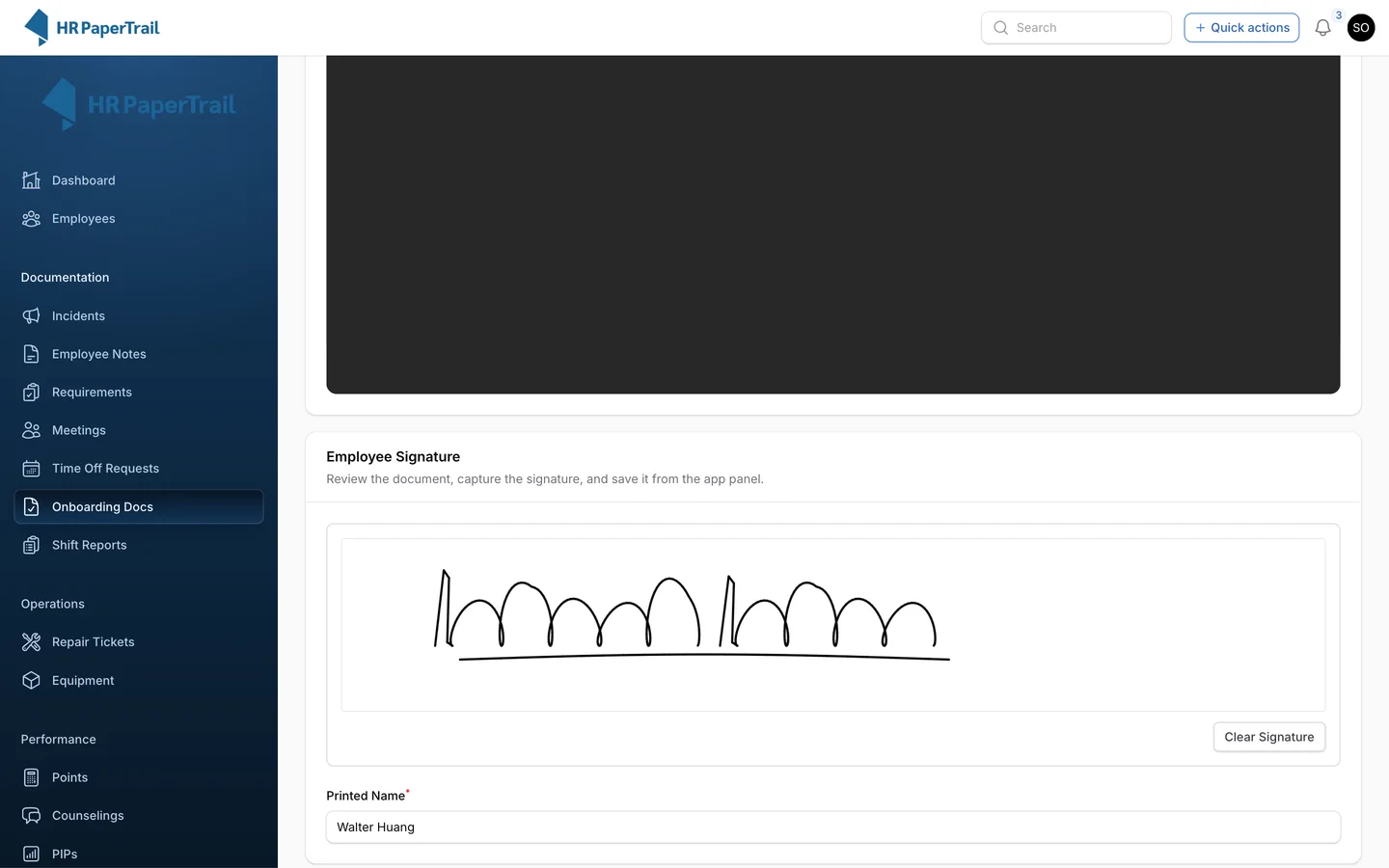 Employee signing the Employee Handbook 2026 on screen with a signature pad below the document